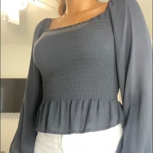 A black off the shoulder or on the shoulder blouse